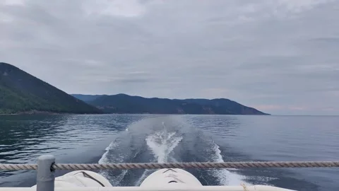 Hydrofoil boat sailing on river creating wake. 動画素材 334860385