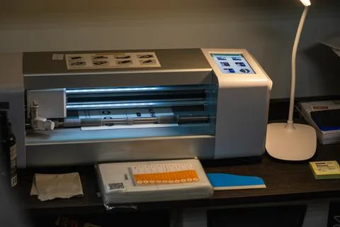 Hydrogel film plotter operating in a modern workshop during a creative projec Stock Photos