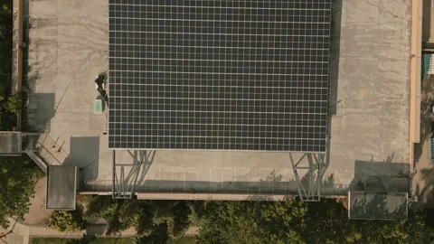 Hydrogen facility solar array crossing revealing ground equipment captured by Vídeo Stock 334248734
