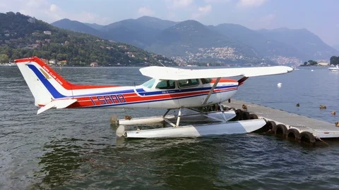 Hydroplane side view moored on the Como lake on a summer day Stock Footage 118649346