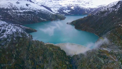 Hydropower generated from arch dam and reservoir lake Stock Footage 141153667