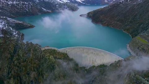 Hydropower generated from arch dam and reservoir lake Stock Footage 141317064