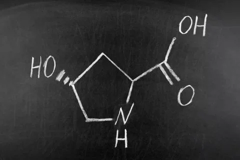 Hydroxyproline (Hyp) amino acid. Essential component of collagen on blackboard Foto stock