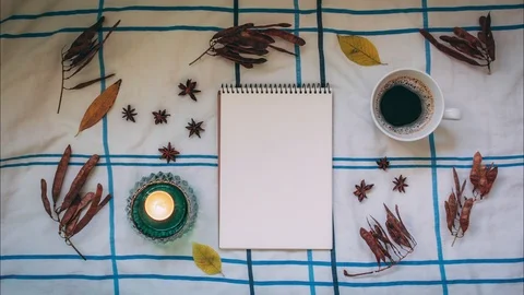 Hygge stop motion. Notebook with copy space, animated drinking coffee with Stock Footage 96128060