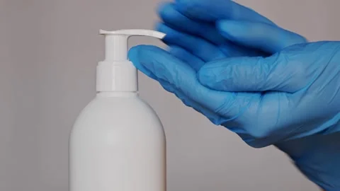 Hygiene in medicine, physician's hands being disinfected with alcohol. Stock Footage 308397706