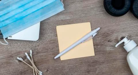 Hygiene in the office. remote work kit on wooden desk. Stock Photos