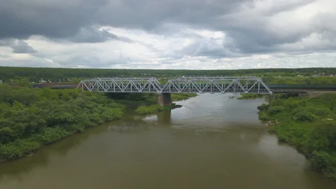 Hyper lapse aerial view of train bridge over small river in Siberia, Russia Stock-Footage 110296986
