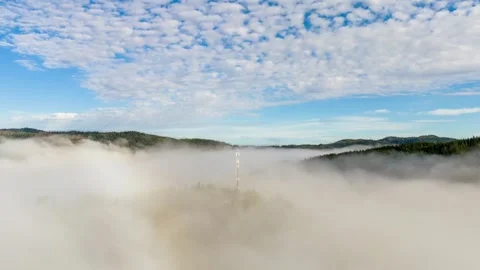 Hyper lapse of an antenna on a hill with clouds moving Stock Footage 252879768