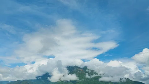Hyper lapse Arial view of Mist drifts over the towering Doi Luang Chiang Dao. Stock Footage 302260302