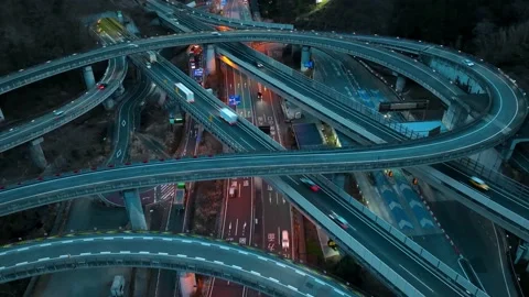 Hyper lapse of busy traffic on highway intersection at night, urban Stock Footage 231403229