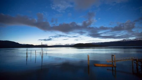Hyper-lapse of of clouds floating over an abandoned dock Stock Footage 113262736