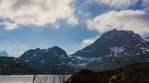 Hyper lapse of clouds over a lake in Lofoten Stock Footage 112717794