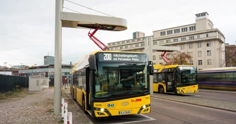 Hyper lapse of electric bus charging, electric transport in Berlin Stock Footage 145140659