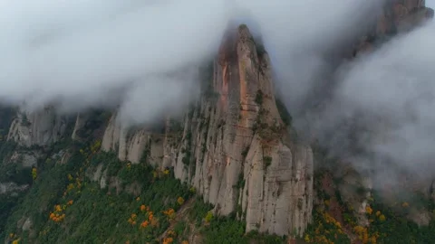 Hyper lapse of fog moving over autumn forest and mountain peaks, dramatic time Stock Footage 165164211