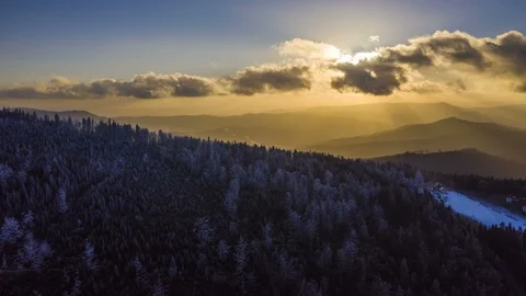 Hyper lapse of forest and mountains silhouettes in sunset, 4k aerial Stock-Footage 100023668