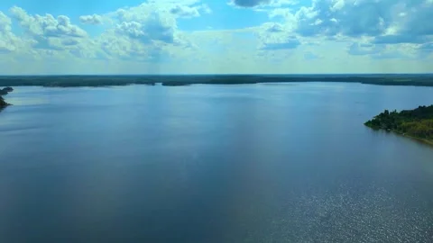 Hyper Lapse Lake with clouds and forest.  Video stock 246160647