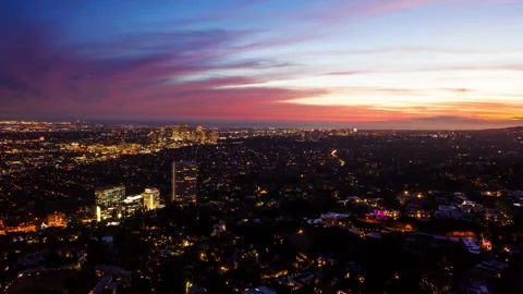 Hyper lapse over the illuminated Beverly Hills cityscape, dusk in Los Stock Footage 164518792
