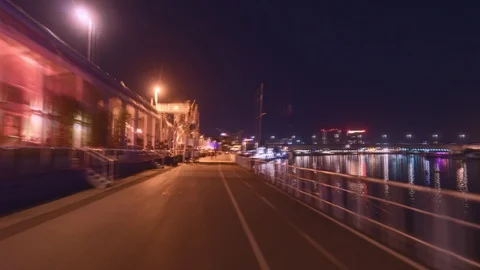 Hyper lapse of promenade by the river at night	 Stock Footage 127827324