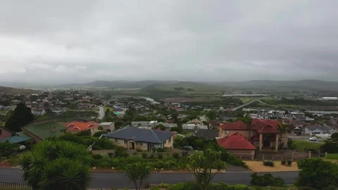 Hyper Lapse of rain clouds rolling over head bbq fire smoke from houses Video stock 260805970