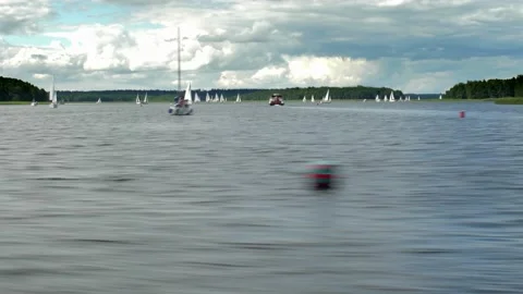 Hyper Lapse Sailing on Big Lake Passing by Yachts and Boats Video stock 136061724
