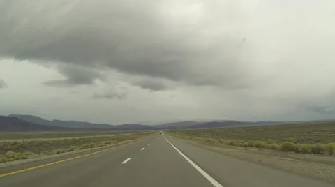 Hyper lapse shot driving west on I-80 in Nevada on a stormy day in Spring Stock Footage 62304818