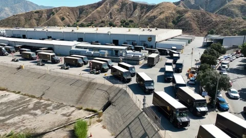 Hyper lapse - time lapse UPS (United Parcel Service) drivers and delivery trucks Stock Footage 246391009