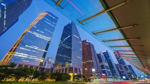 Hyper lapse - Traffic on the road in front of a modern design building Financial Stock Footage 247993186