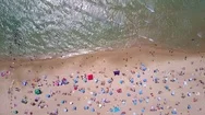 Hyper Lapse Of A Tropical Beach With Colorful Umbrellas - Top Down Aerial View Stock Footage