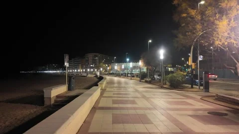 Hyper lapse walking in the city at night on the empty Spanish street, Blanes Stock Footage 270745241
