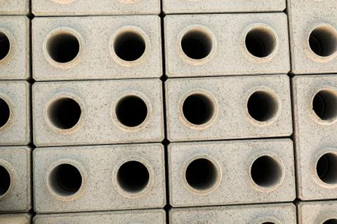 Hyper-pressed hollow facing bricks stacked on a pallet. Top view. Stock Photos
