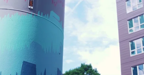 Hyper Timelapse of Clouds Moving between buildings and Painted Pillar. Stock Footage 98665692