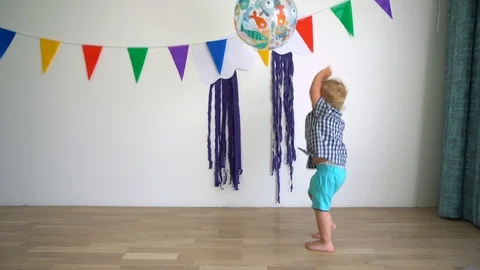 Hyperactive child boy playing with big ball. Kid throwing ball. Gimbal movement Stock Footage 114694386
