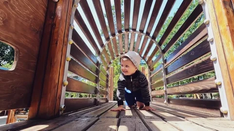 Hyperactive child crawling. Concepts of rules of safety, freedom, loneliness Stock Footage 247928941