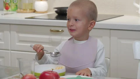 Hyperactive excited child at dinner table Stock Footage 296473029