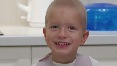 Hyperactive excited child at dinner table. Stock Footage 296473475