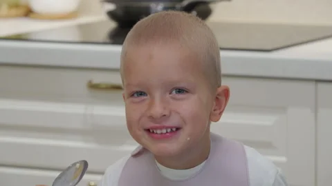 Hyperactive excited child at dinner table. Stock Footage 300028244