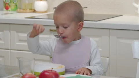 Hyperactive excited child at dinner table. Stock Footage 300028395