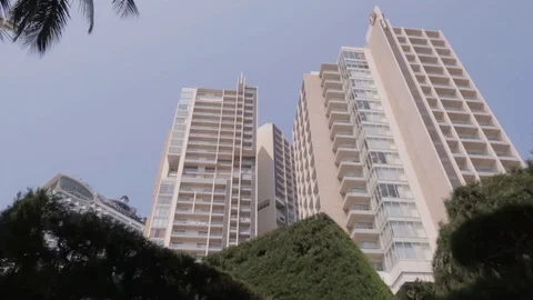Hyperlapes skyscraper in Nha Trang, view through palm trees Stock Footage 117432287