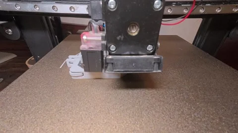 Hyperlapse of a 3D printer creating a plastic part on the build plate. Additive Stock Footage 325995016