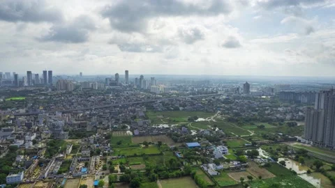 Hyperlapse aerial drone shot over gurgaon showing monsoon clouds with light rays Stock Footage 216641372