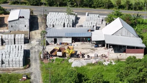 Hyperlapse aerial view of a brick making factory with the activities of wor.. Stock Footage 339257107