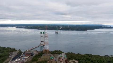 Hyperlapse Aerial View of Chacao Bridge Tower Construction and Channel, Chile Stock Footage 345009575