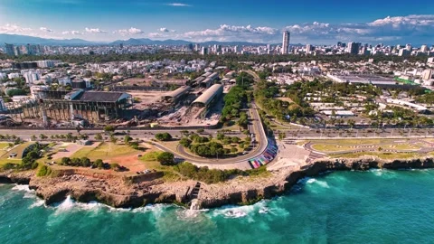Hyperlapse Aerial View of Coastal City Skyline and Ocean Waves at Santo Domingo Stock Footage 335169960