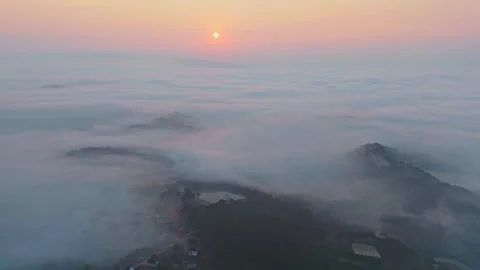 Hyperlapse aerial view drone flying over sea of fog at sunrise Stock Footage 297826068