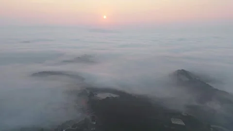 Hyperlapse aerial view drone flying over sea of fog at sunrise Stock Footage 297826557