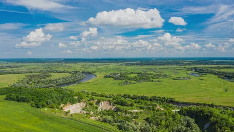 Hyperlapse aerial view of a summer landscape and summer cloudy skies.  Stock Footage 160363406