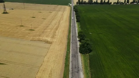Hyperlapse Aerial view of Village with Roads near to Hills, Sown Fields, Forest Stock Footage 162621653