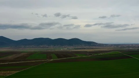 Hyperlapse -  agricultural fields with hills in the background Видео 127937589