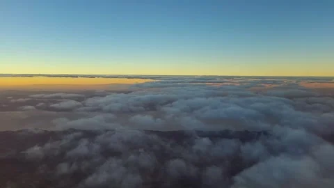 Hyperlapse of an ascent above the clouds at sunrise 4K Stock Footage 262018140