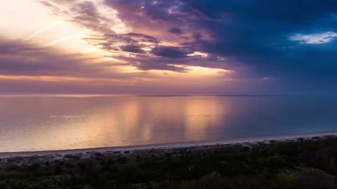 Hyperlapse of Baltic Sea Coastline at Sunset With Dramatic Stormy Pērkone Clouds Stock Footage 308462700